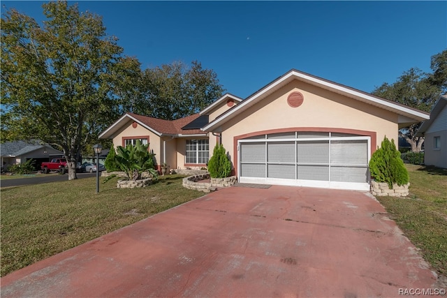 single story home featuring a garage and a front lawn