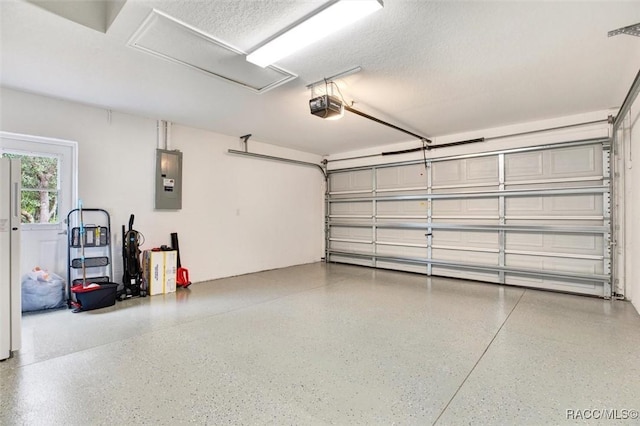 garage featuring a garage door opener and electric panel