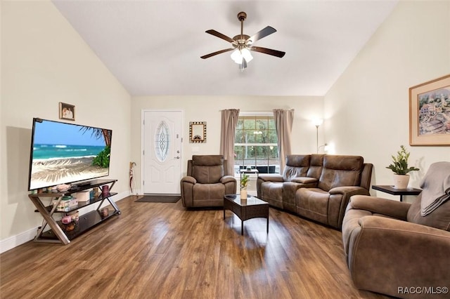 living area with a ceiling fan, baseboards, high vaulted ceiling, and wood finished floors