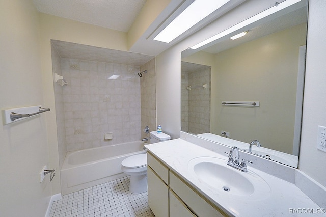 full bathroom featuring vanity, tile patterned flooring, tiled shower / bath combo, toilet, and a textured ceiling