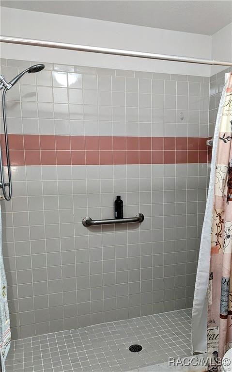 bathroom with a shower with curtain