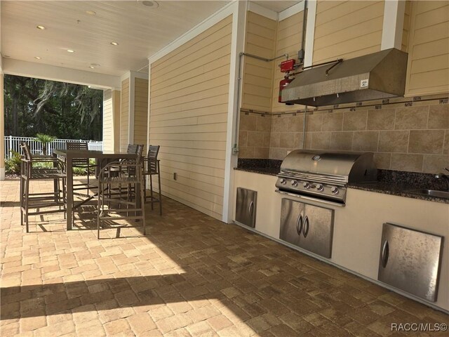 956 Ibis Cir, Inverness, FL 34453 - view of patio / terrace with a sink and outdoor dining space