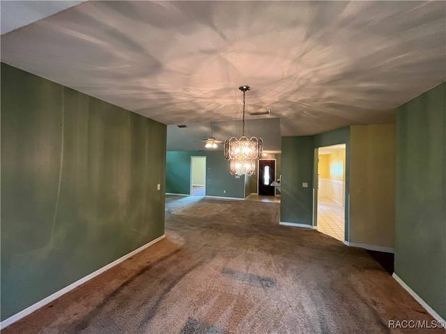 unfurnished dining area with a chandelier and carpet flooring