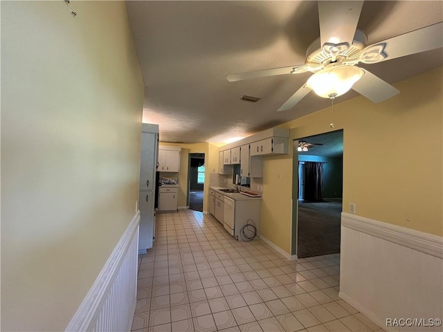 2788 W Elm Blossom St, Beverly Hills, FL 34465 - kitchen featuring ceiling fan, light tile patterned floors, white cabinetry, and light countertops