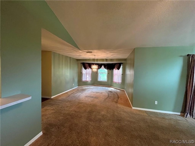 2788 W Elm Blossom St, Beverly Hills, FL 34465 - spare room with a chandelier, carpet, lofted ceiling, and a textured ceiling