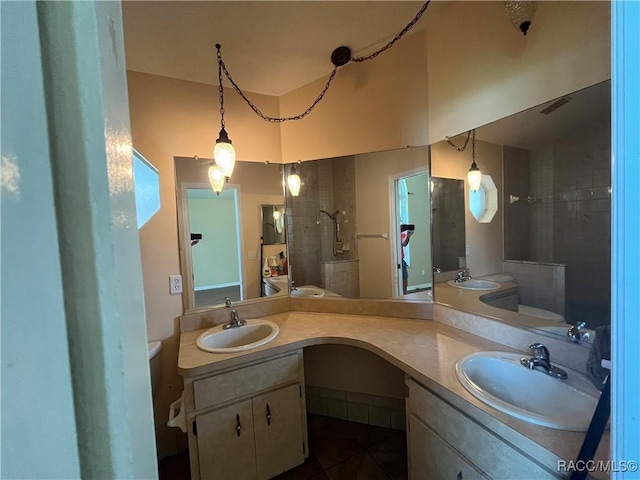 2788 W Elm Blossom St, Beverly Hills, FL 34465 - full bathroom with tile patterned floors, double vanity, and a tile shower