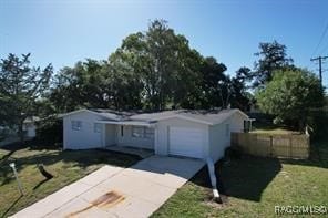 view of front of home with a garage and a front yard