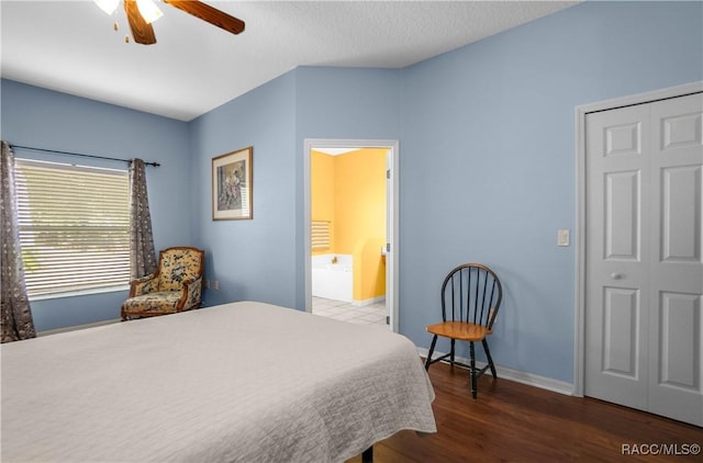 bedroom featuring a closet, ceiling fan, and dark hardwood / wood-style flooring