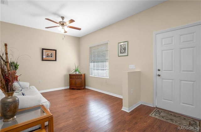 foyer entrance with ceiling fan and dark hardwood / wood-style floors