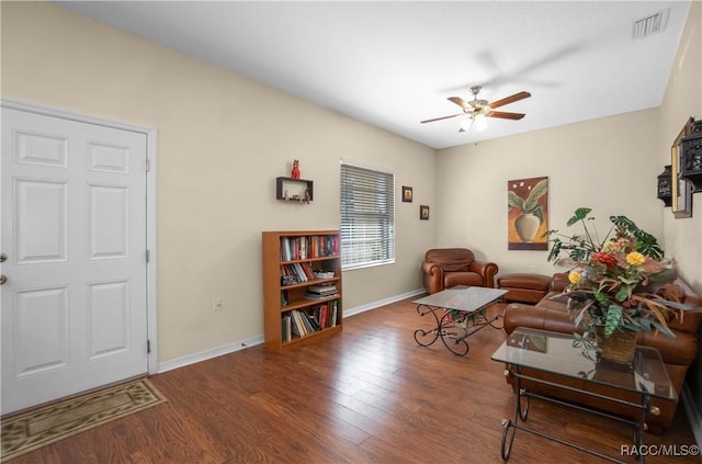 living room featuring hardwood / wood-style flooring and ceiling fan