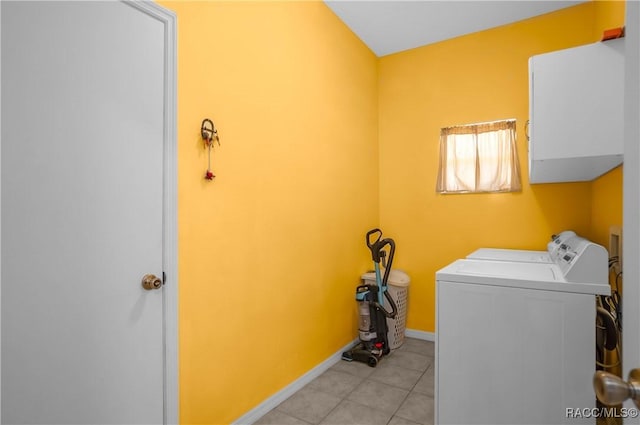 laundry area featuring light tile patterned flooring and washer and dryer