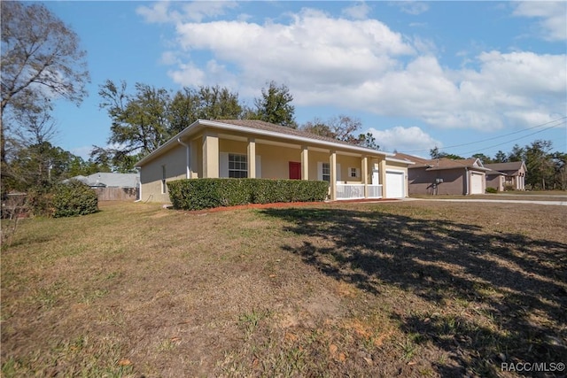 ranch-style house featuring a porch, a garage, and a front lawn