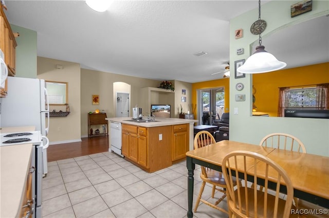 kitchen with ceiling fan, decorative light fixtures, sink, light tile patterned flooring, and white appliances