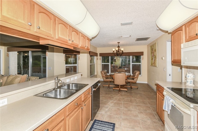 kitchen featuring white appliances, sink, light tile patterned floors, a chandelier, and hanging light fixtures