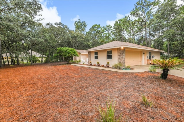 view of front of property with a garage