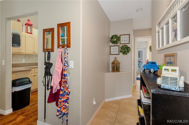 hallway with light hardwood / wood-style flooring