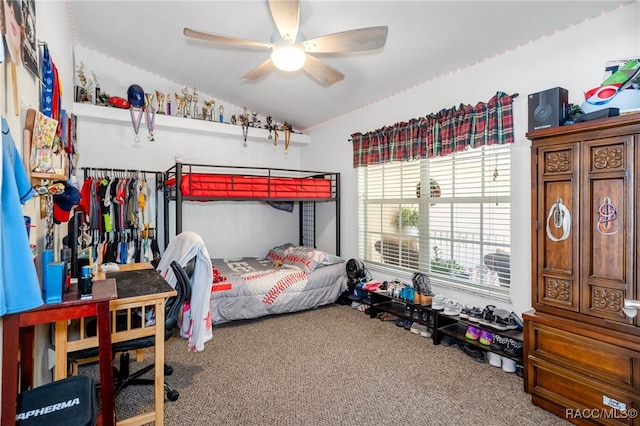 bedroom featuring carpet floors, ceiling fan, and lofted ceiling