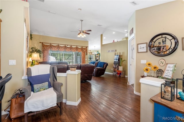 living room with ceiling fan, dark hardwood / wood-style floors, and vaulted ceiling