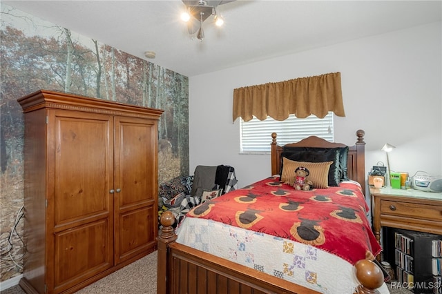 bedroom featuring light colored carpet