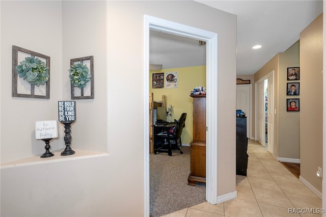 hallway with light tile patterned floors