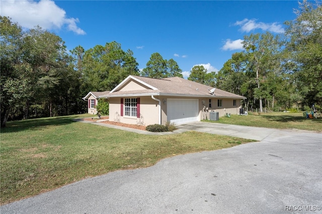 single story home with a front yard, central AC unit, and a garage