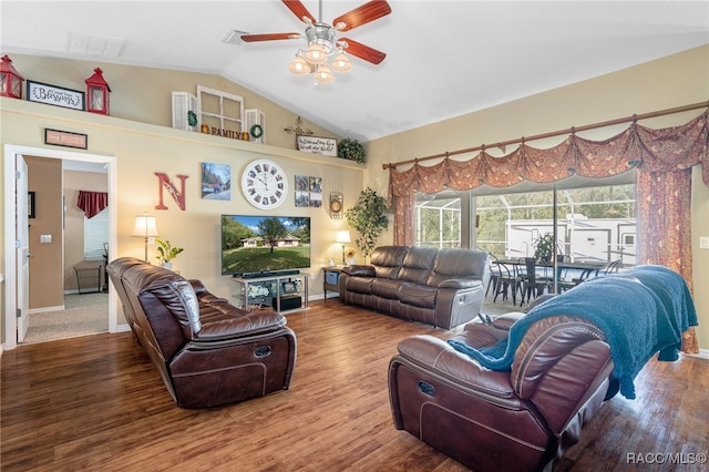 living room with ceiling fan, wood-type flooring, and lofted ceiling