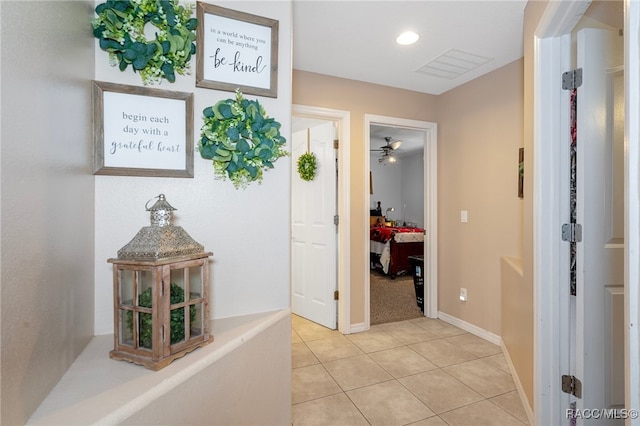 corridor featuring tile patterned flooring