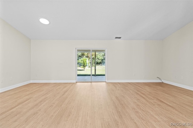 empty room with light hardwood / wood-style floors