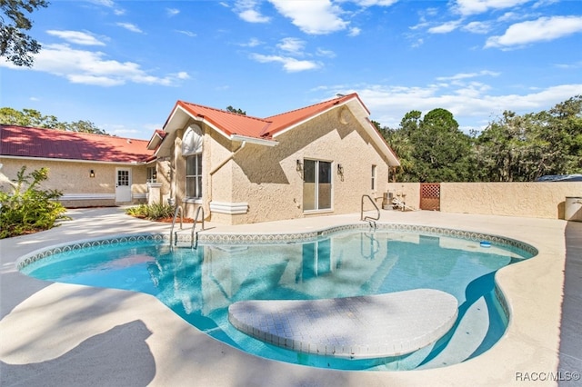 view of swimming pool with a patio area