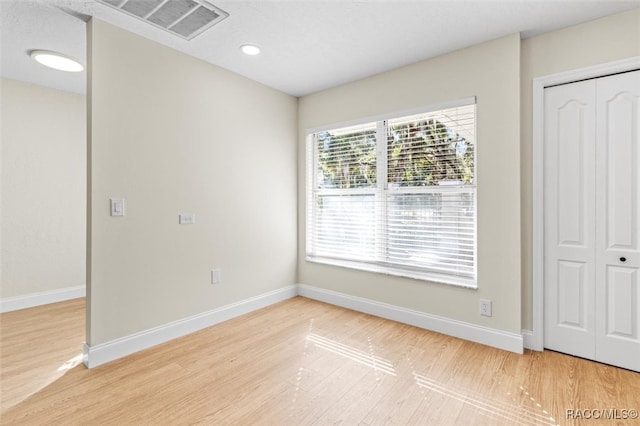 interior space featuring hardwood / wood-style floors and a closet