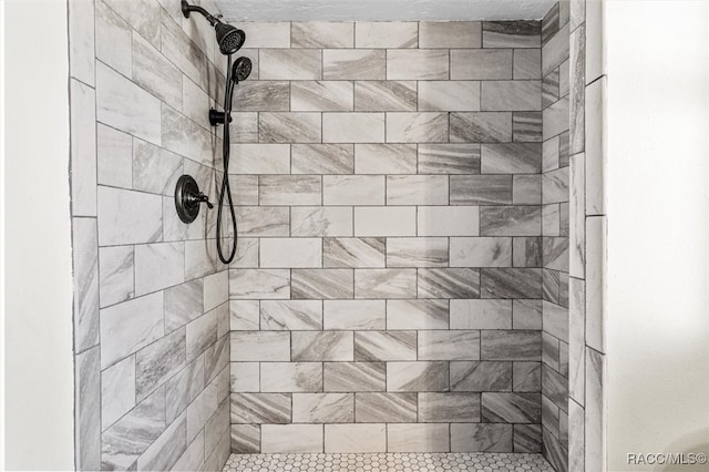 bathroom with tiled shower