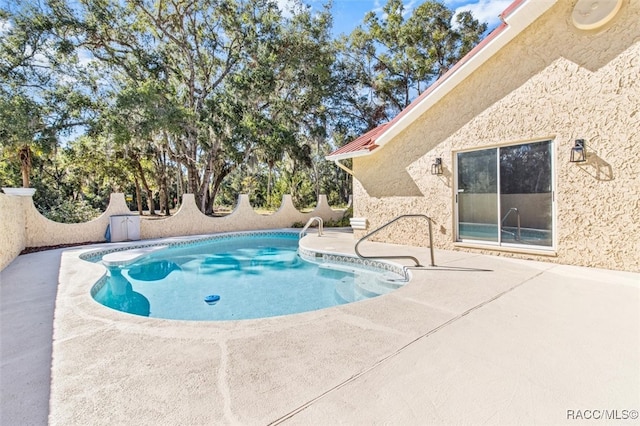 view of pool with a patio