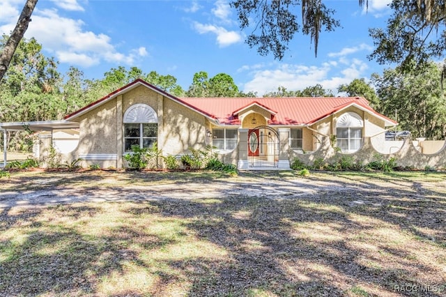 view of front of house featuring a carport