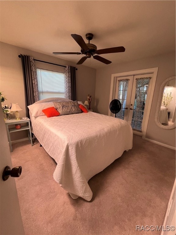 bedroom featuring carpet, french doors, access to exterior, and ceiling fan