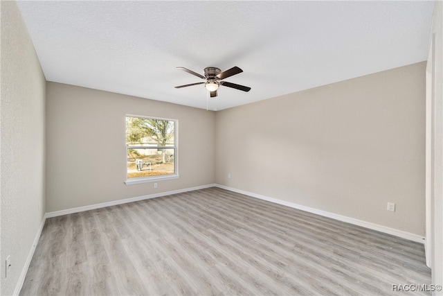 unfurnished room with ceiling fan, a textured ceiling, and light hardwood / wood-style flooring