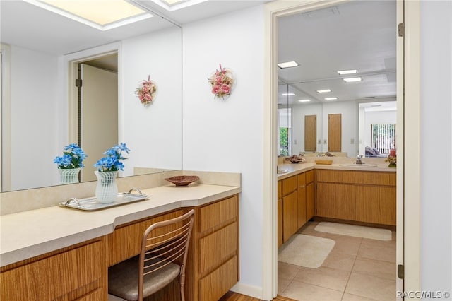 bathroom with tile patterned floors and vanity