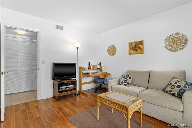 living room with wood-type flooring