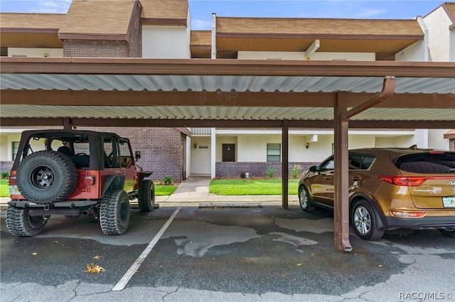 view of vehicle parking featuring a carport