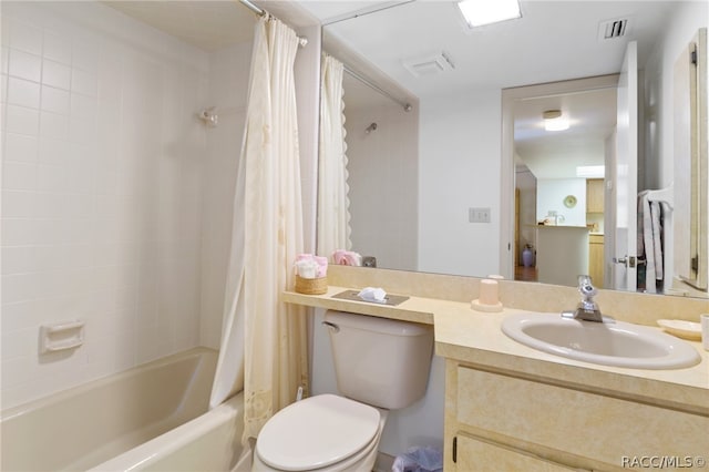 full bathroom featuring shower / tub combo with curtain, vanity, and toilet