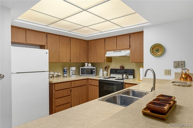 kitchen with white appliances and sink