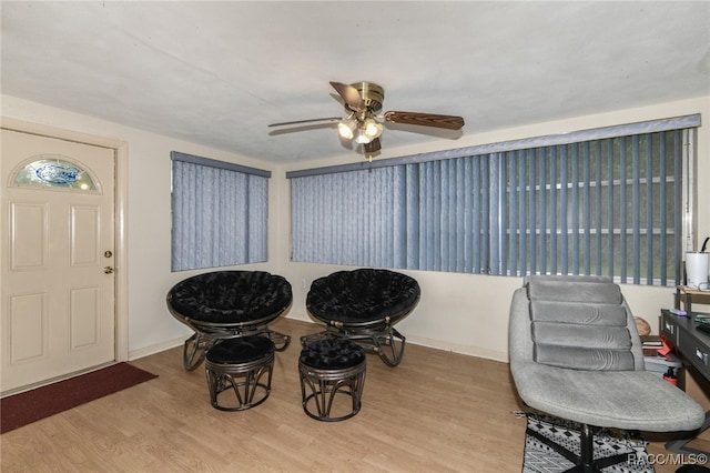 dining room with ceiling fan and light hardwood / wood-style flooring