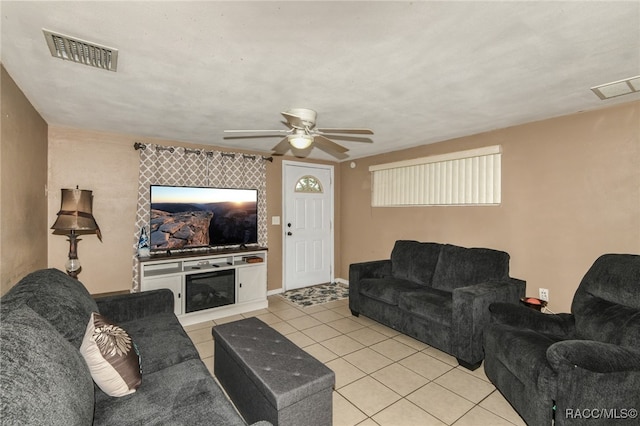 living room featuring ceiling fan and light tile patterned flooring