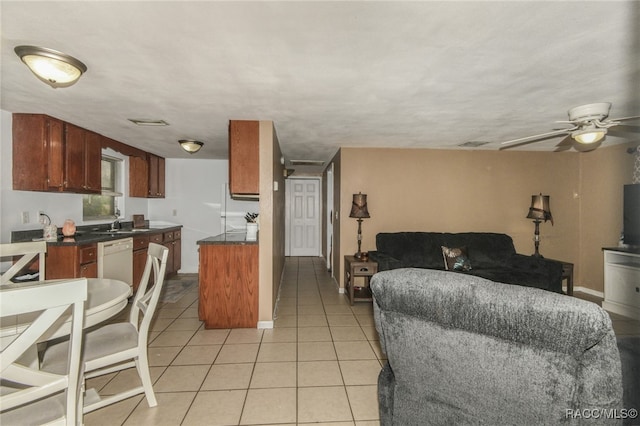 kitchen featuring dishwasher, light tile patterned flooring, and ceiling fan