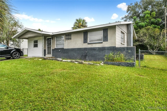 ranch-style house with a front lawn