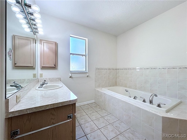 bathroom with tile patterned flooring, double vanity, a bath, and a sink