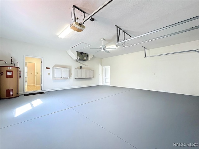 garage featuring water heater and a garage door opener