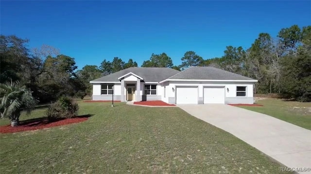 ranch-style house featuring a garage, concrete driveway, a front yard, and stucco siding