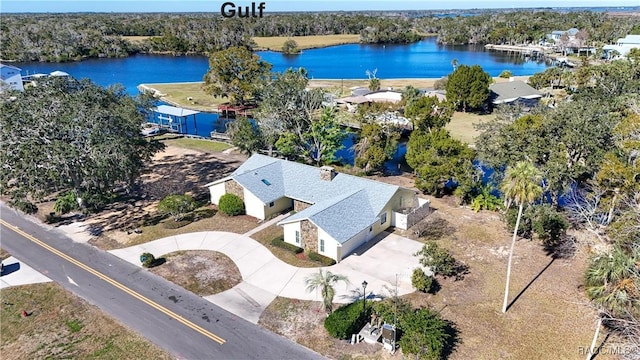 birds eye view of property featuring a water view