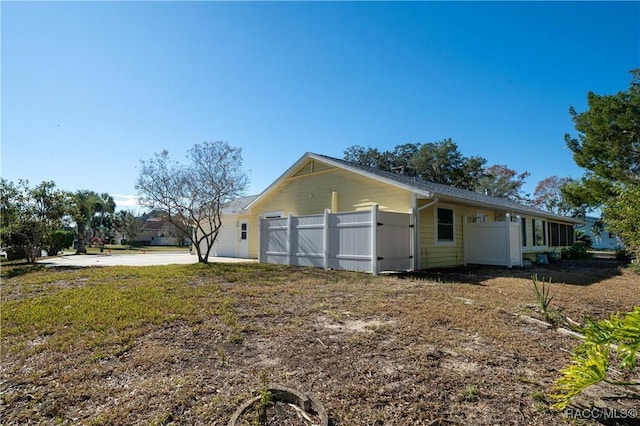 view of property exterior featuring fence