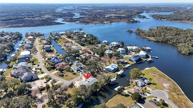 birds eye view of property with a residential view and a water view